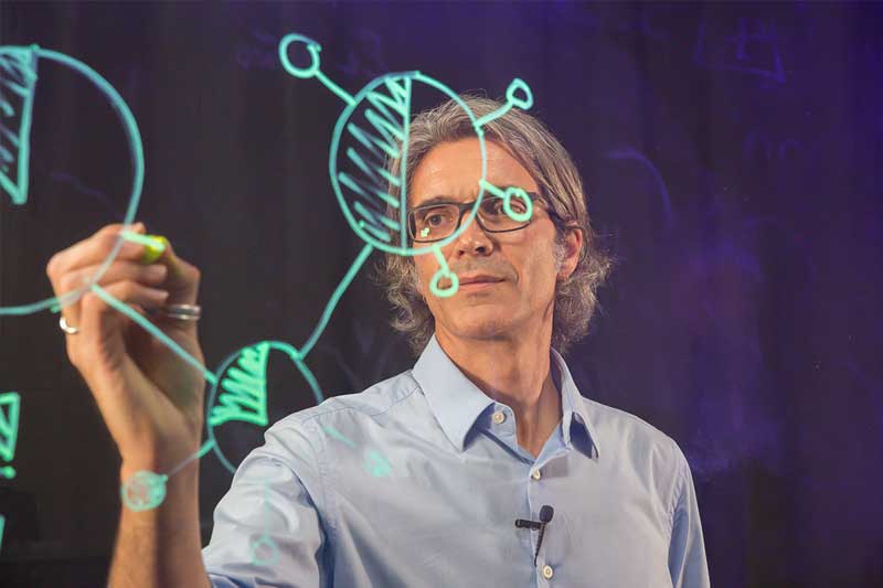 UC Merced Faculty Toolkit - professor sketching on glass