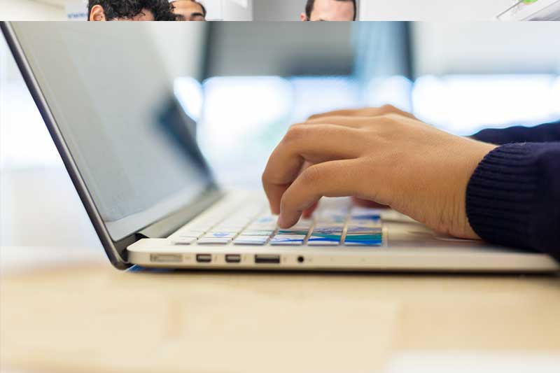 UC Merced faculty toolkit - typing hands on a keyboard