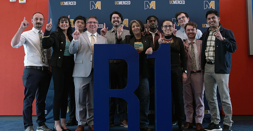 Top nine Grad Slam finalists with graduate dean and associate graduate dean with R1 prop